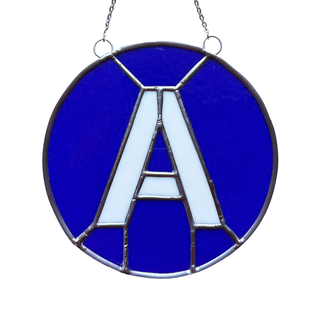 A Train Glass Medallion