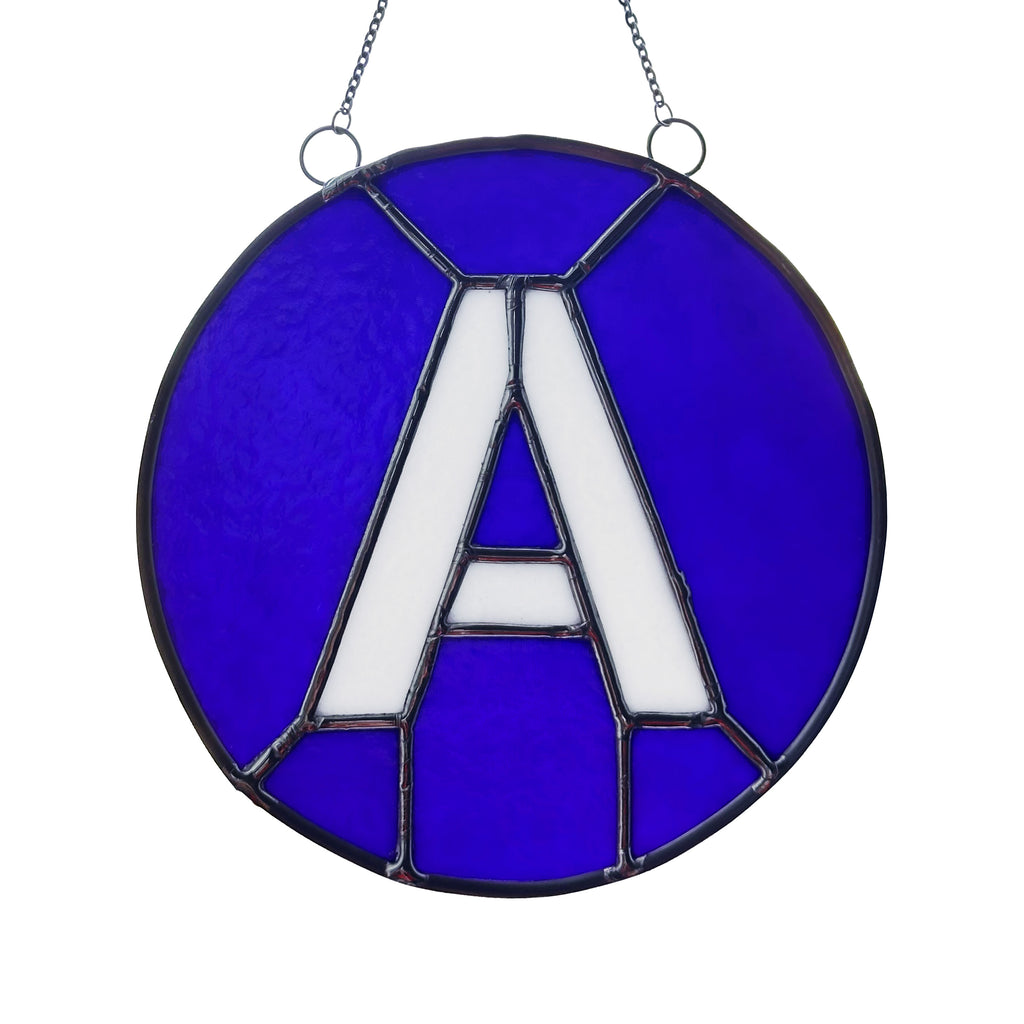 A Train Glass Medallion